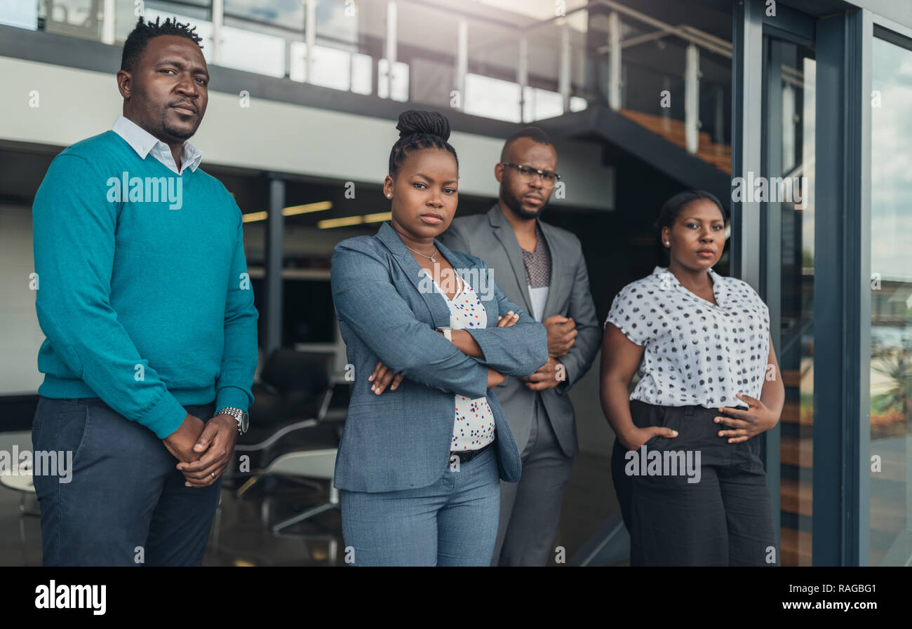 Corporate african american team standing with confidence Stock Photo