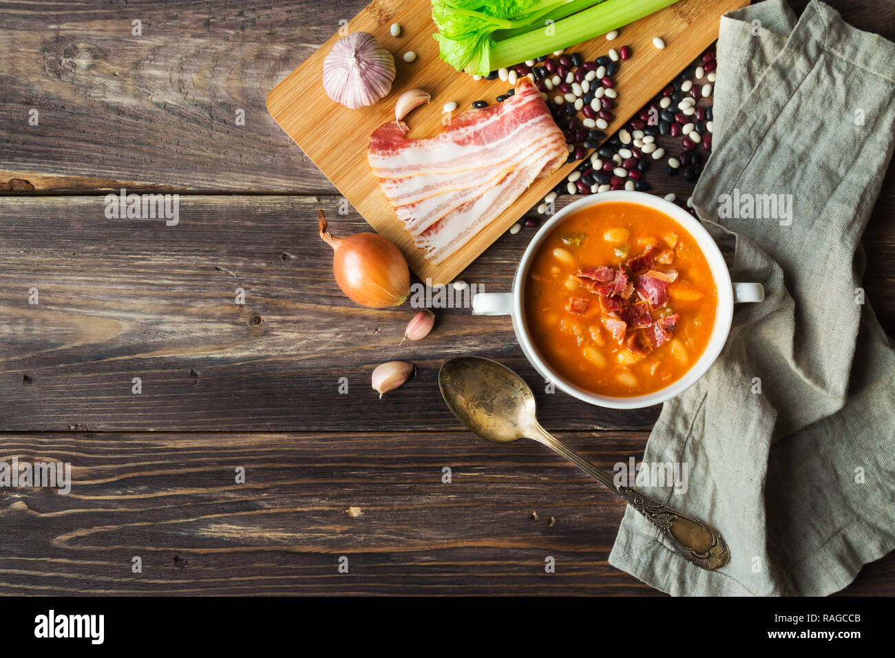 Homemade bean soup in white bowl on rustic wooden background with ...