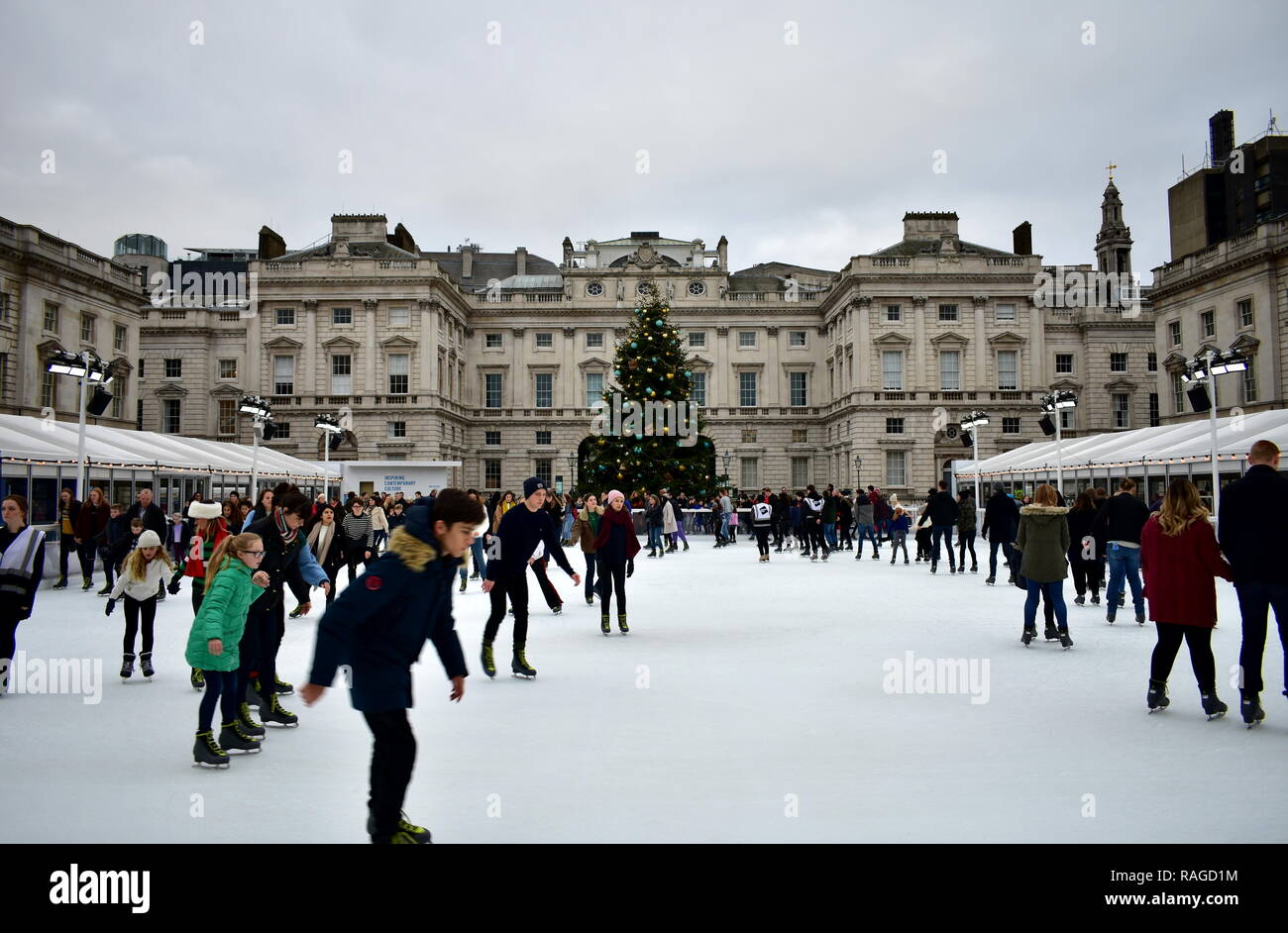 People skating on ice at the Somerset House Christmas Ice Rink. London ...