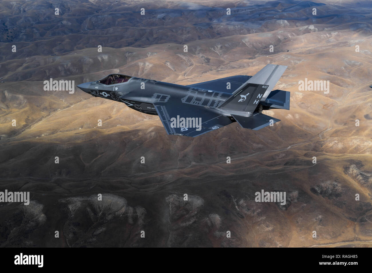 A U.S. Navy F-35C Lightning II fighter aircraft with Strike Fighter Squadron 147 in formation over central California November 16, 20189 near Lemoore, California. Stock Photo