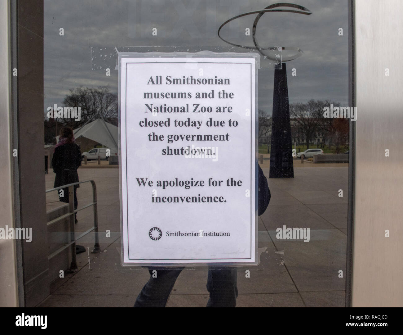 Sign taped to the  door of the National Museum of American Histoyr reads, 'All Smithsonian museums and the National Zoo are closed today due to the go Stock Photo