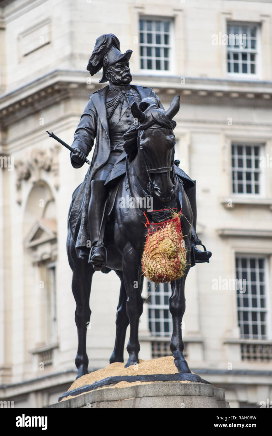 Equestrian statue of Prince George, Duke of Cambridge life-size memorial by Adrian Jones, installed in Whitehall, London. UK. Added feedbag nose bag Stock Photo