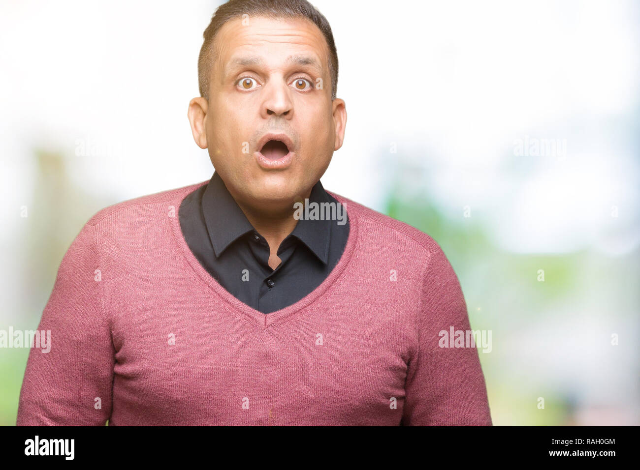Middle age arab man over isolated background afraid and shocked with surprise expression, fear and excited face. Stock Photo