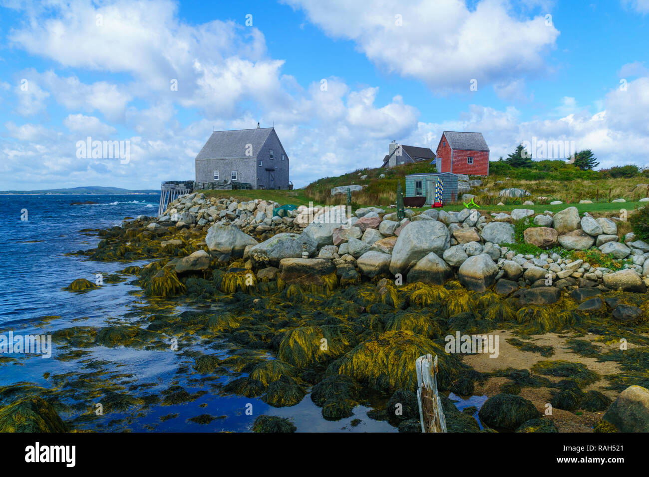 View of rocky shore and waterfront houses in the fishing village Indian