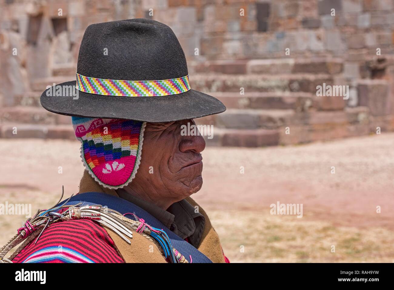 Indigenous man in typical national clothing with typical hat, Tihuanaku, Tiawanacu, Tiahuanaco, UNESCO World Heritage Site Stock Photo