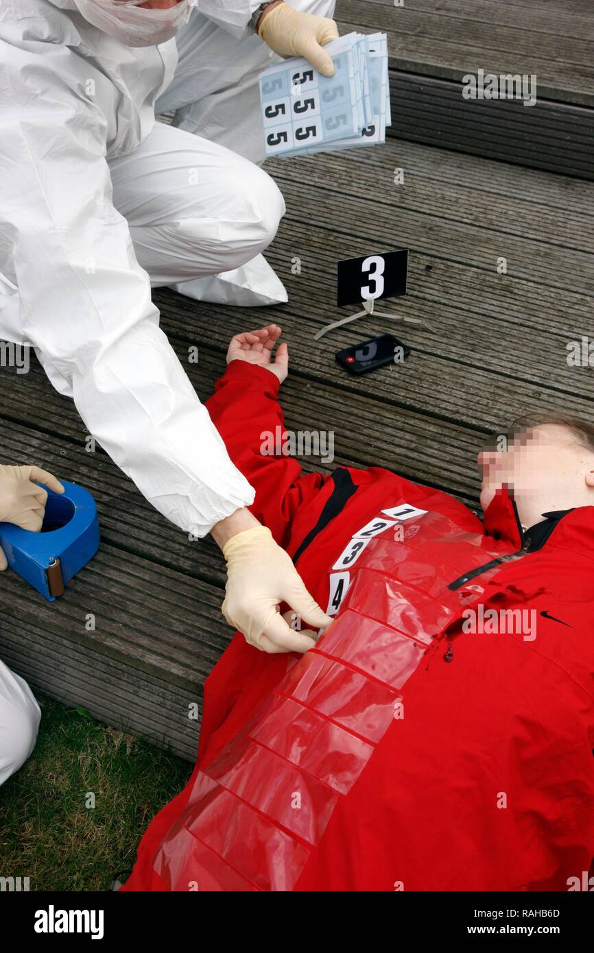 Securing of evidence at a crime scene after a capital offence, murder, homicide, scene of crime officers, crime scene department Stock Photo
