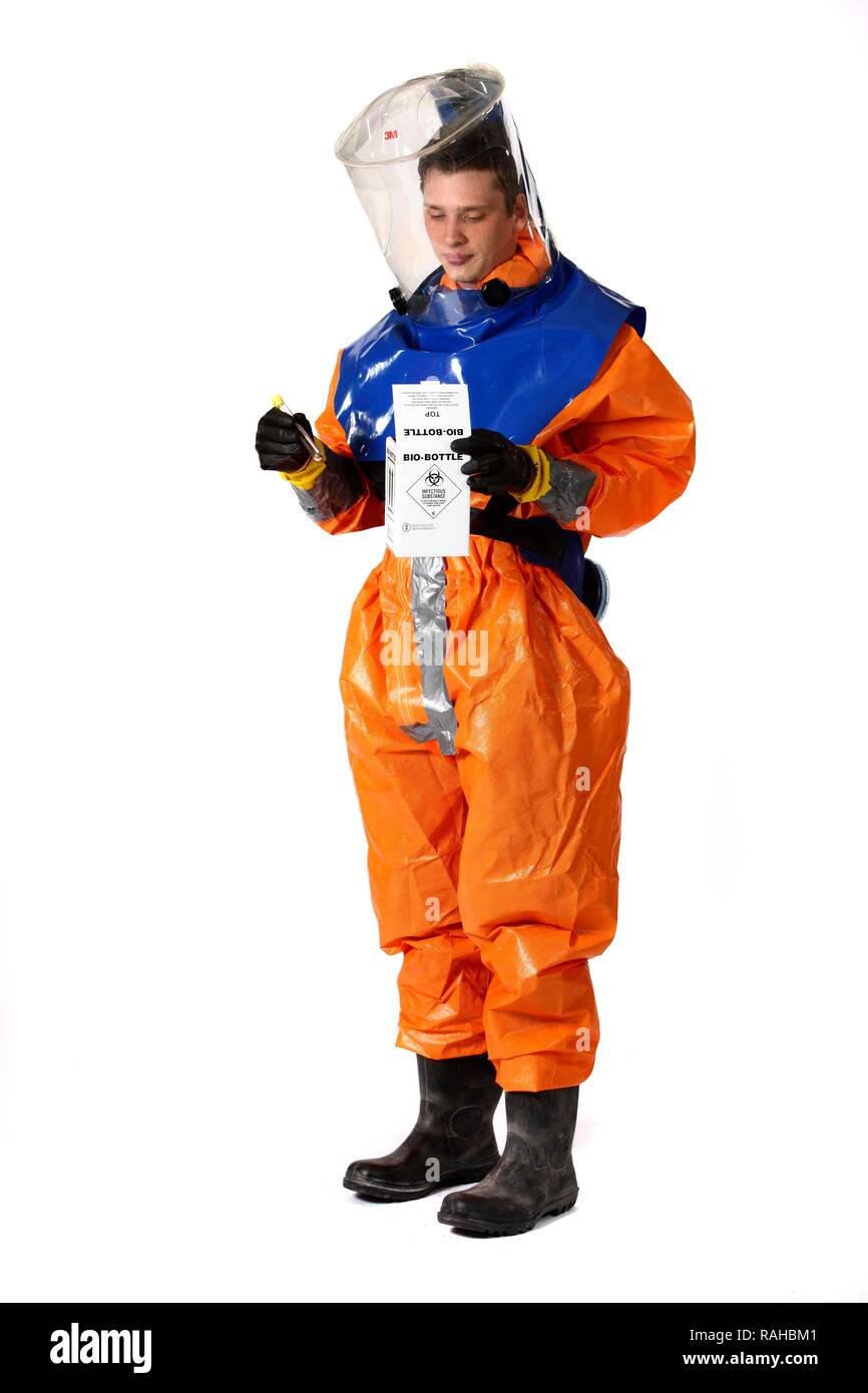 Firefighter wearing a protective suit for disease control holding a container for gathering samples, professional firefighter Stock Photo