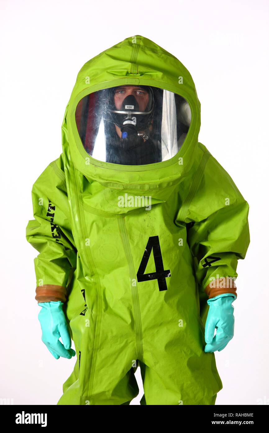 Firefighter wearing a chemical protective suit with air supply from a compressed air breathing apparatus, professional Stock Photo