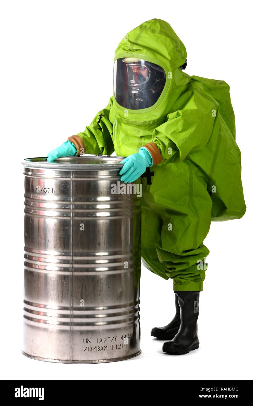 Firefighter wearing a chemical protective suit with air supply from a compressed air breathing apparatus, professional Stock Photo