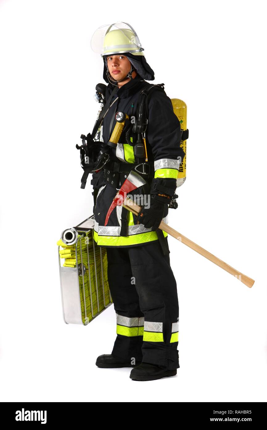 Fireman, part of a response squad for firefighting, with protective clothing made of Nomex, a helmet with a visor, a fire axe, Stock Photo