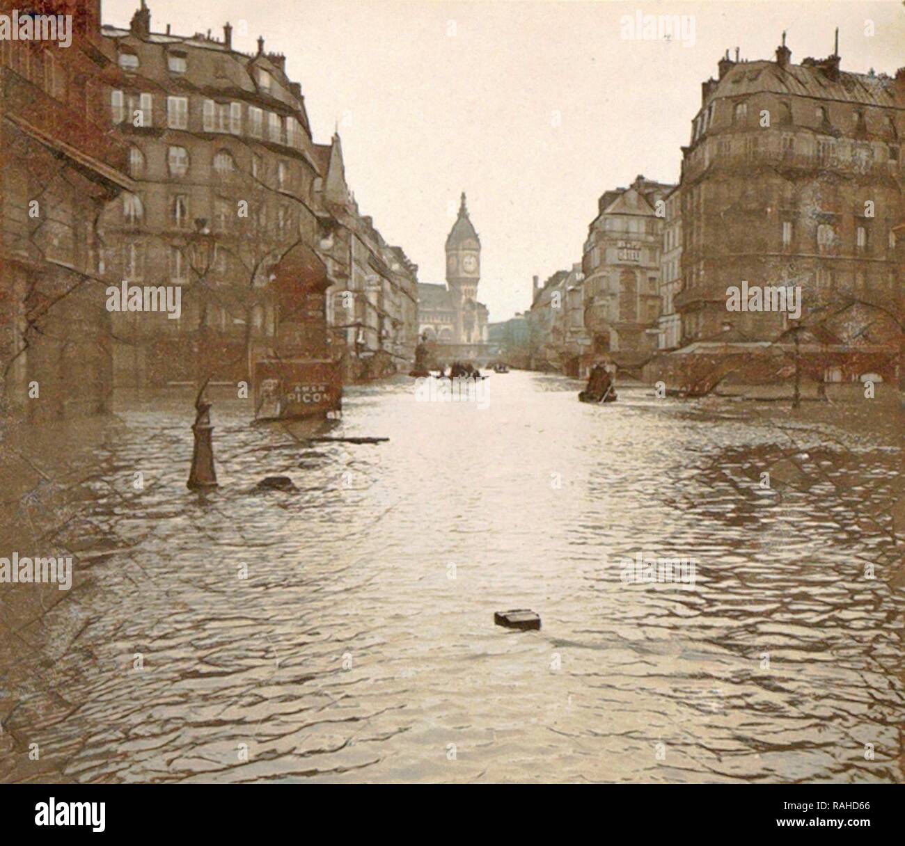 Flooded street in Paris, in the background le Tour de l'Horloge, France, 1910. Reimagined by Gibon. Classic art with reimagined Stock Photo