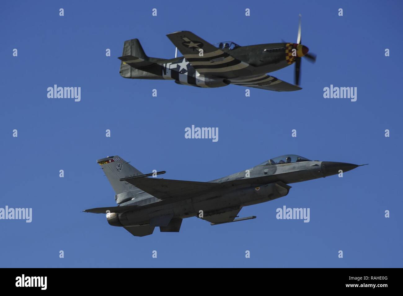 A U S Air Force F 16c Fighting Falcon And A P 51 Mustang Fly In Formation