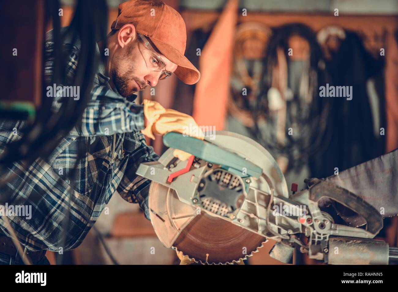Circular Wood Saw Job. Caucasian Contractor Worker and the Cutting