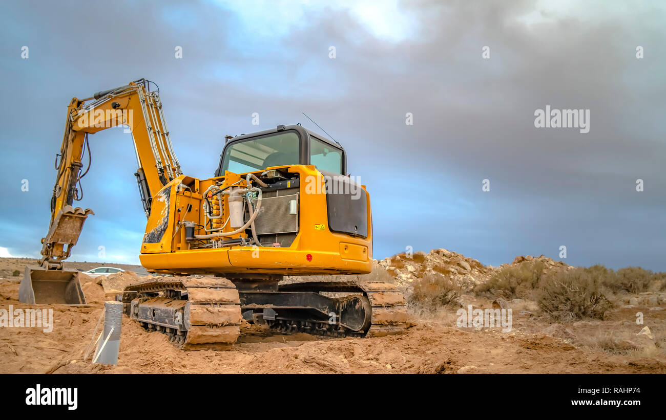 Excavator tractor seen from back with empty sky Stock Photo Alamy