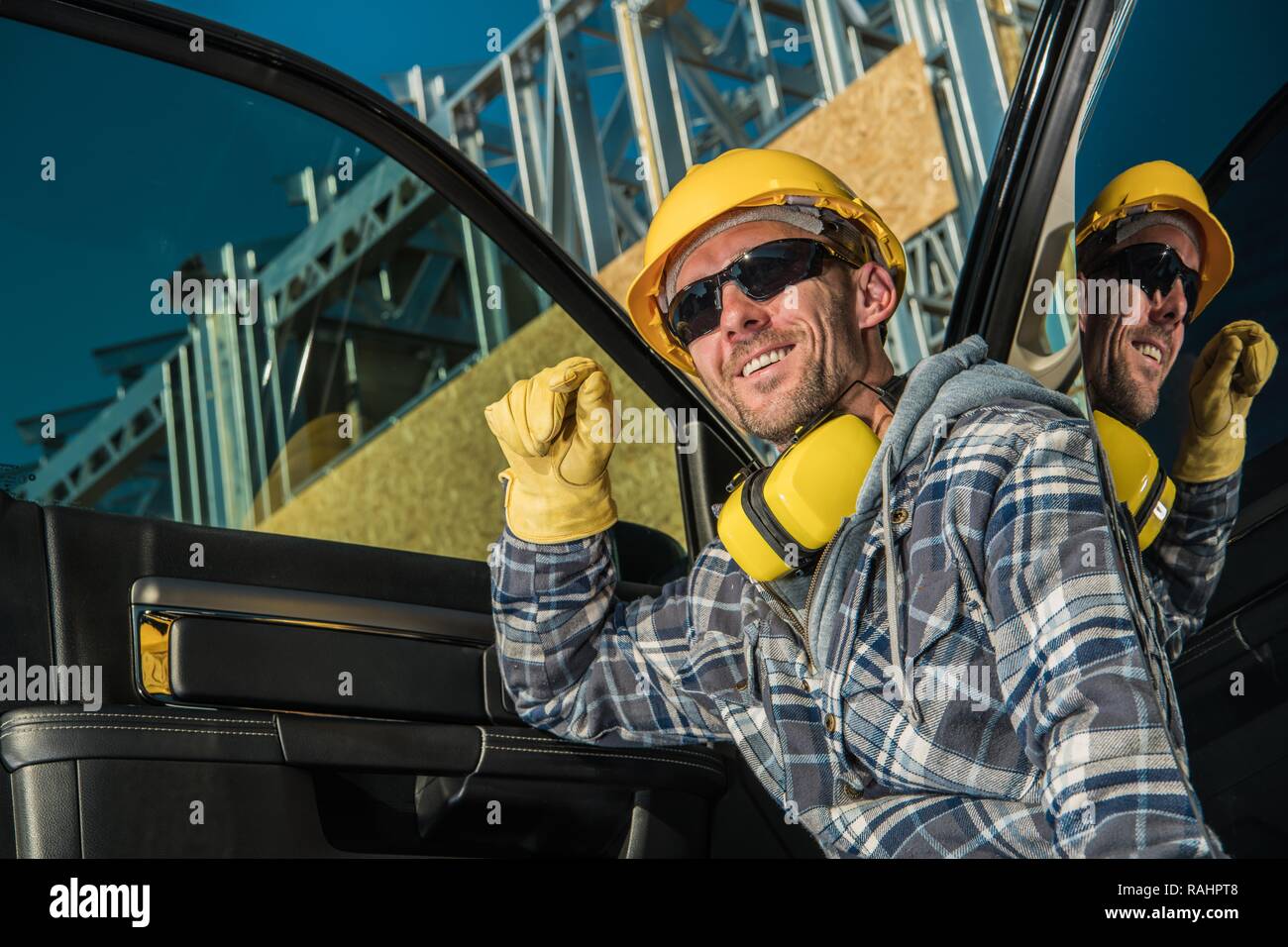 Happy Caucasian Construction Contractor Worker in His 30sin Yellow Helmet. Stock Photo