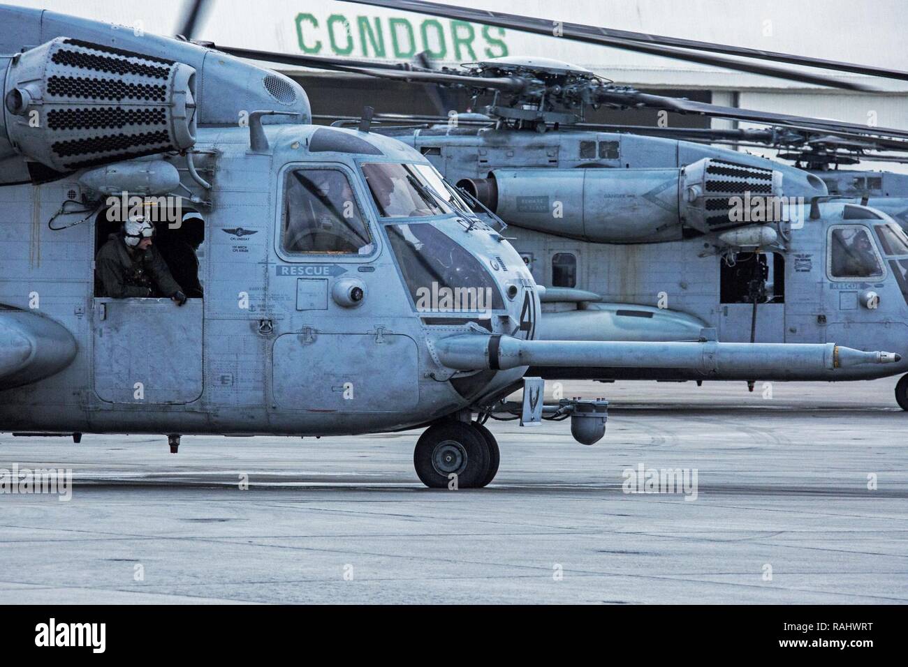 U.S. Marines with Marine Heavy Helicopter Squadron 464 prepare for a “Max Launch”, Marine Corps Air Station New River, N.C., Feb. 3, 2017. The purpose for this flight is to celebrate a rarely achieved maintenance goal of having all aircraft operational at one time. Stock Photo