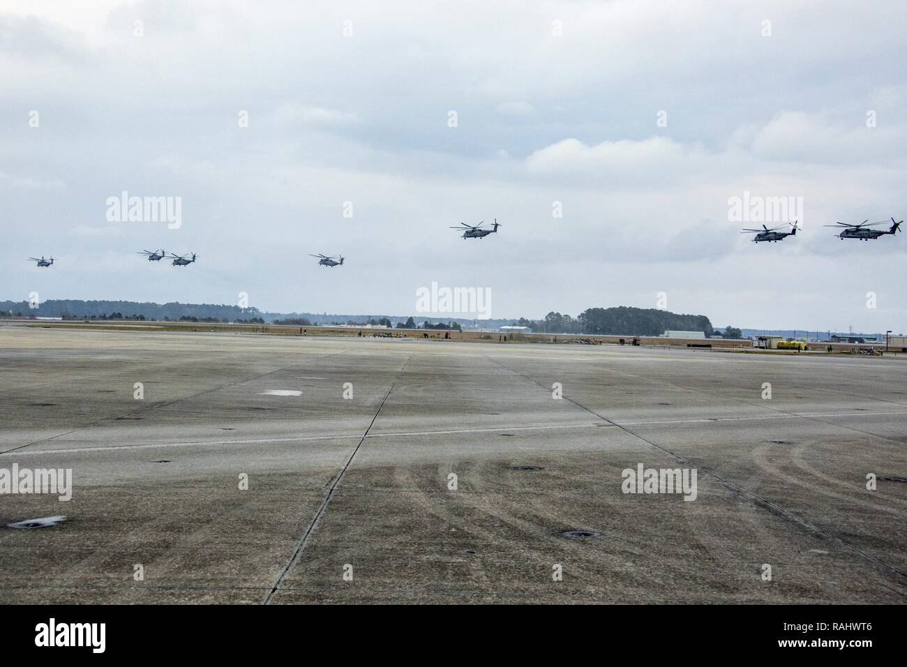 U.S. Marines with Marine Heavy Helicopter Squadron 464 conduct a “Max Launch”, Marine Corps Air Station New River, N.C., Feb. 3, 2017. The purpose for this flight is to celebrate a rarely achieved maintenance goal of having all aircraft operational at one time. Stock Photo