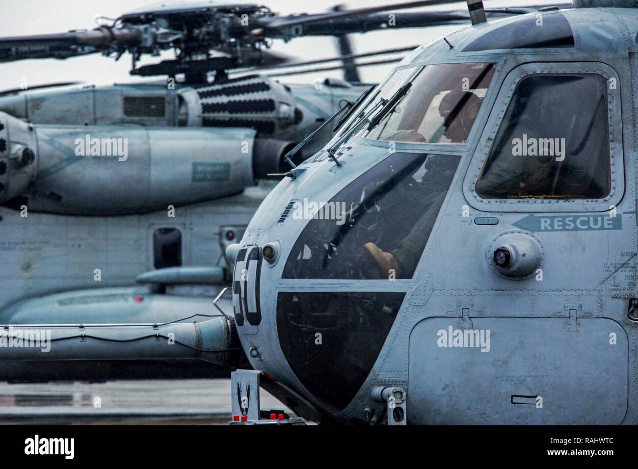 U.S. Marines with Marine Heavy Helicopter Squadron 464 prepare for another take off during a “Max Launch”, Marine Corps Air Station New River, N.C., Feb. 3, 2017. The purpose for this flight is to celebrate a rarely achieved maintenance goal of having all aircraft operational at one time. Stock Photo