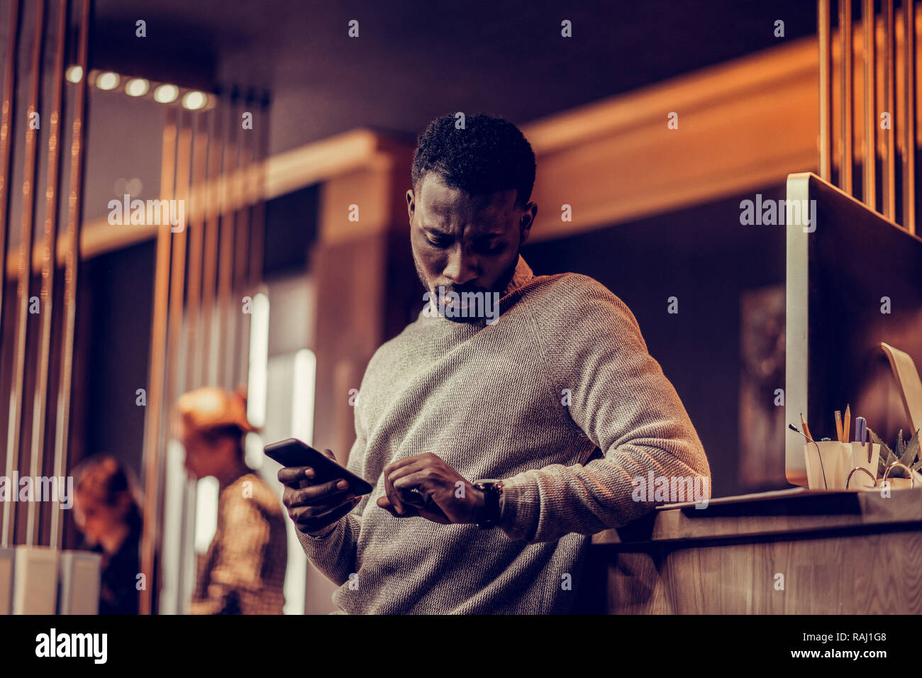 Serious international young man hi-res stock photography and images - Alamy