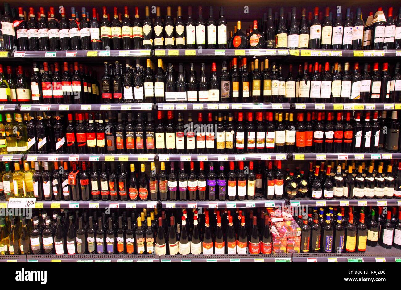 Beverage section red wine shelves self service Stock Photo Alamy