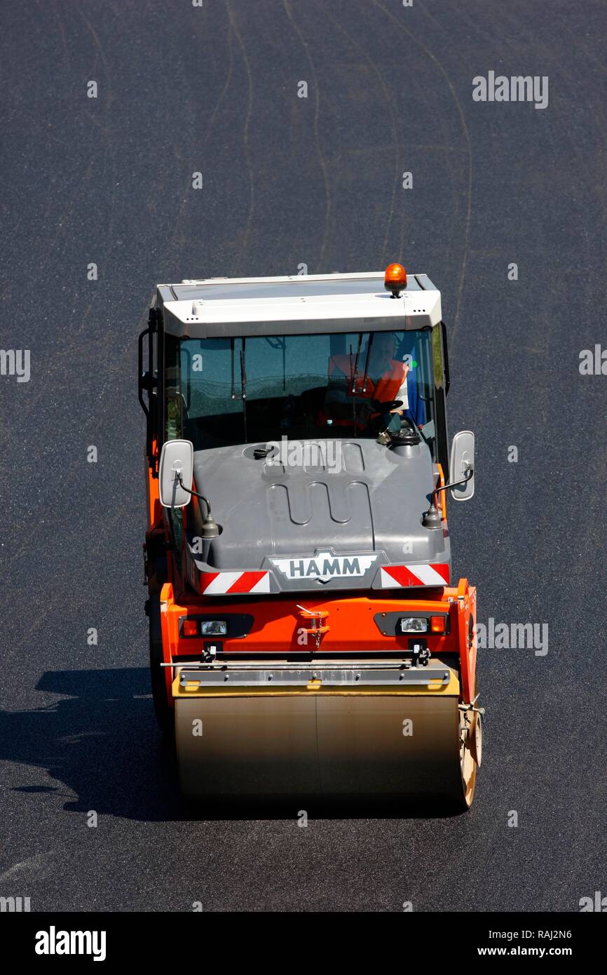 Applying a new asphalt surface, silent tarmac, porous asphalt, noise-absorbing road surface, highway A40 or Ruhrschnellweg Stock Photo
