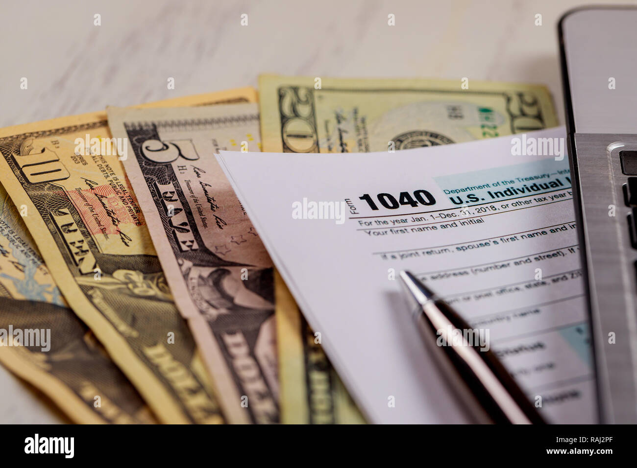 Laptop 1040 tax form hi-res stock photography and images - Alamy