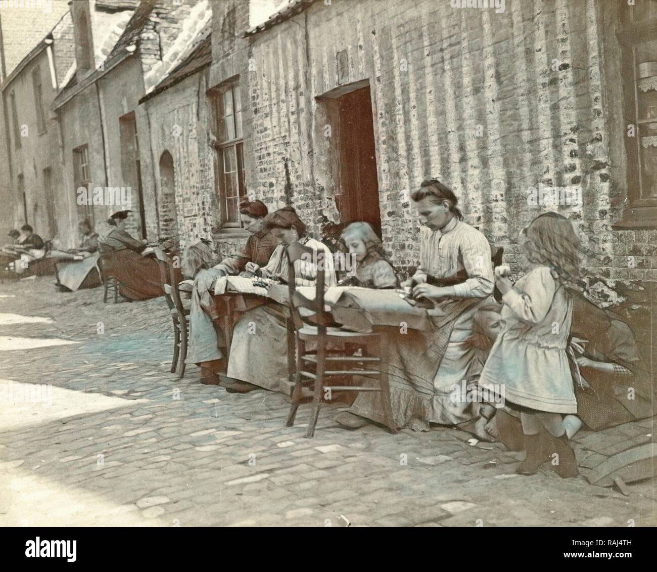 Street and women lacemaking, Anonymous, c. 1900. Reimagined by Gibon. Classic art with a modern twist reimagined Stock Photo