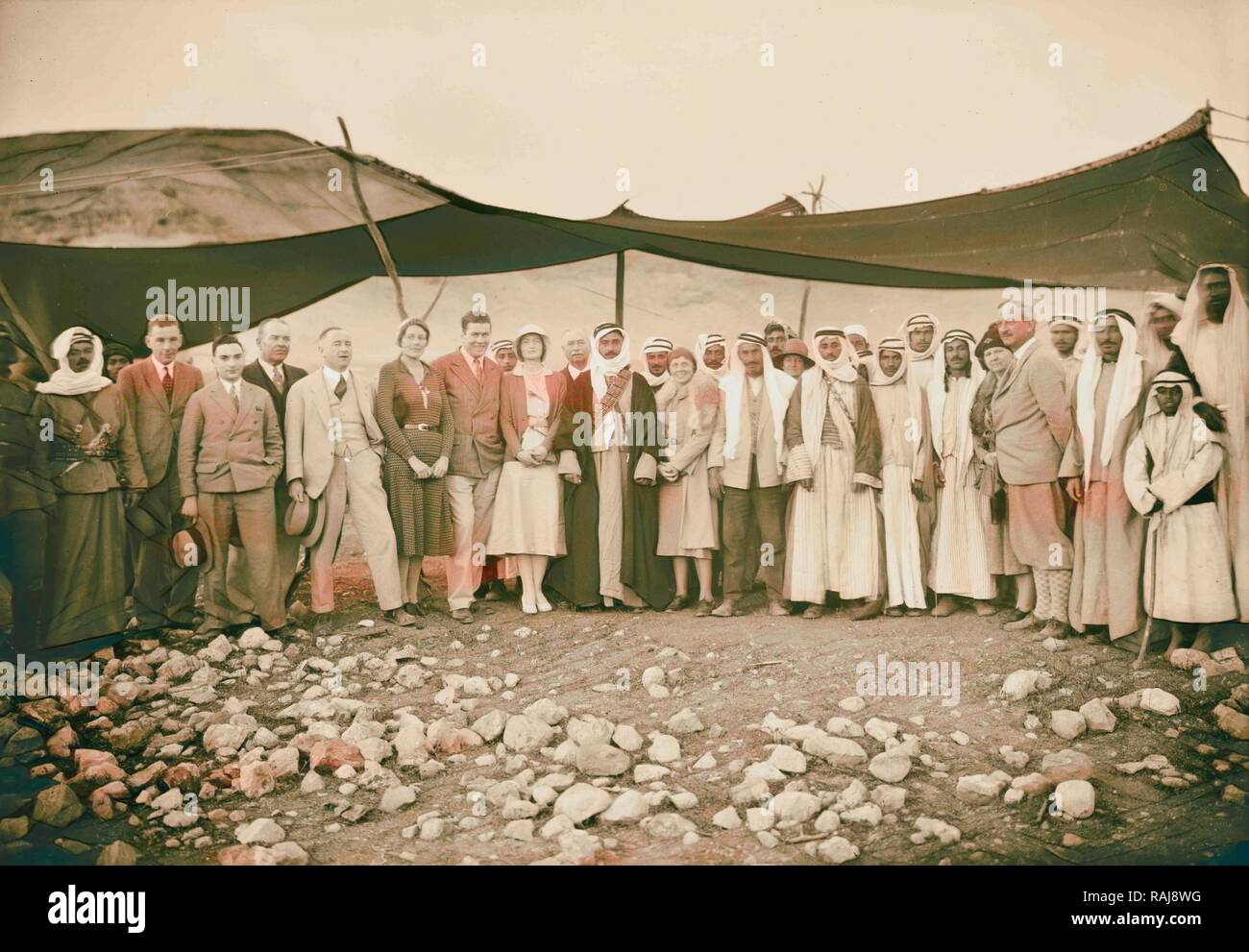 Mr. & Mrs. Tunney at Bedouin camp with Sheik Majid at Shumet Kimrin. Mr. & Mrs. La Gorce, March 1931. Whole group reimagined Stock Photo