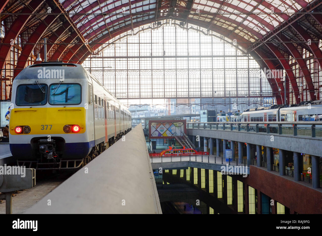 Antwerp, Belgium - Anno 2018: The train is waiting at the platform for passengers Inside the beautiful, historic and monumental Antwerp Train Station. Stock Photo