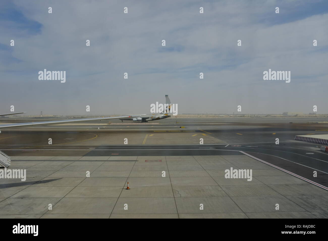 Airplane belongs to Etihad Airline in Abu Dhabi Airport, UAE Stock Photo