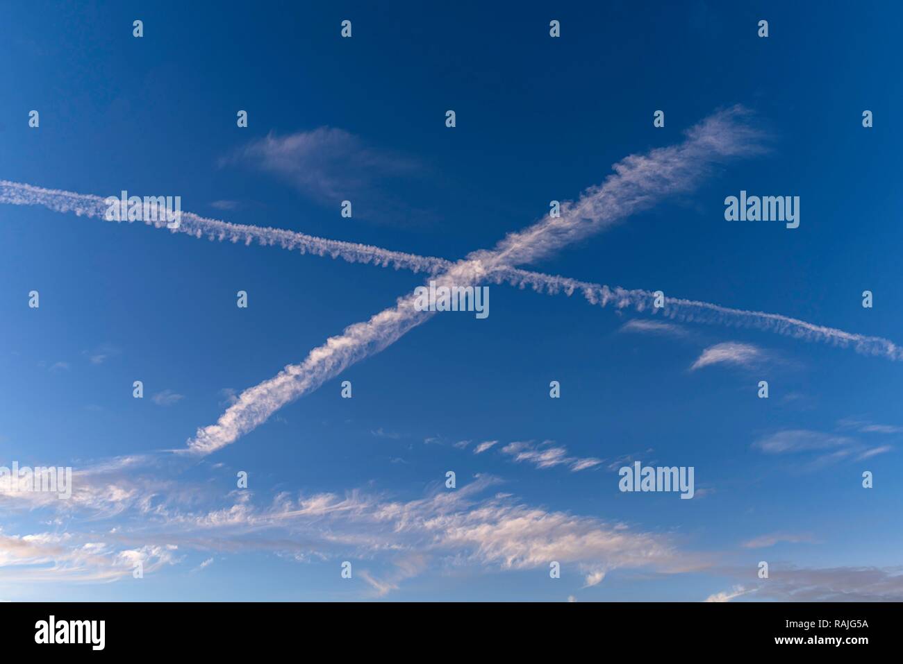 Crossing Condensation Strips in the Blue Sky, Germany Stock Photo