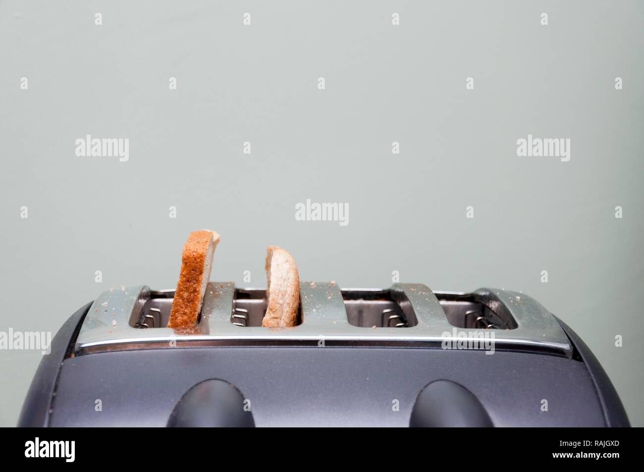 Slices of bread in a toaster Stock Photo Alamy