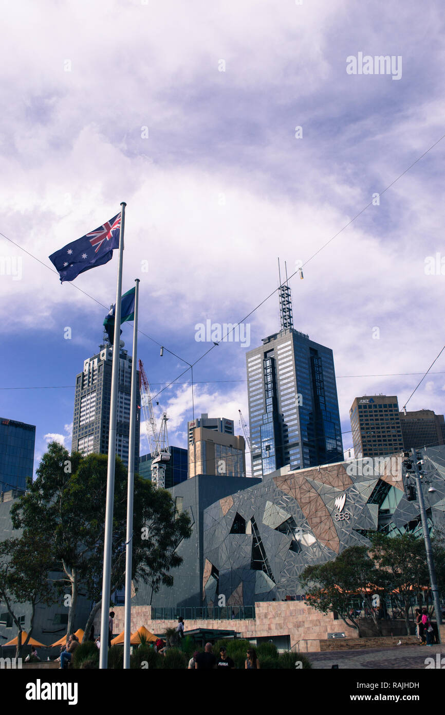 The flag of Australia flying on Federation square in Melbourne, Australia Stock Photo