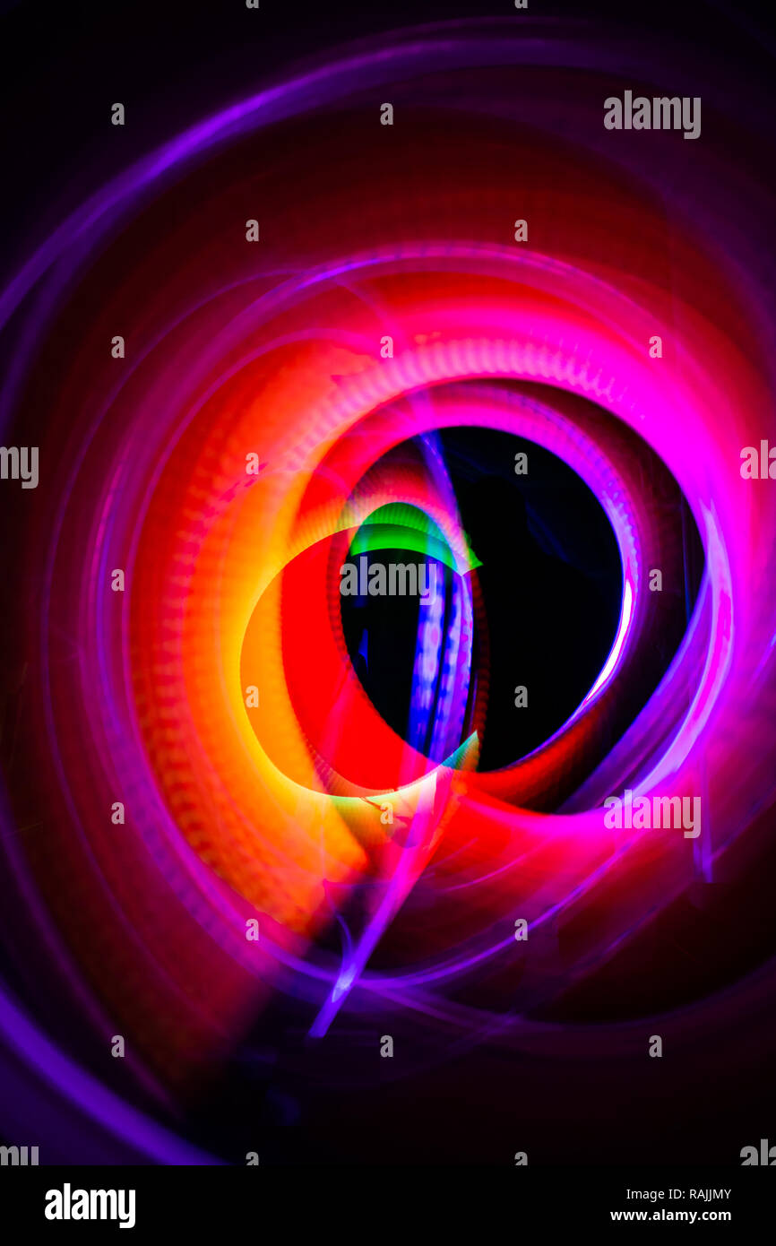 Abstract lights in circles and ovals of different sizes and colors. Light painting photo. Stock Photo