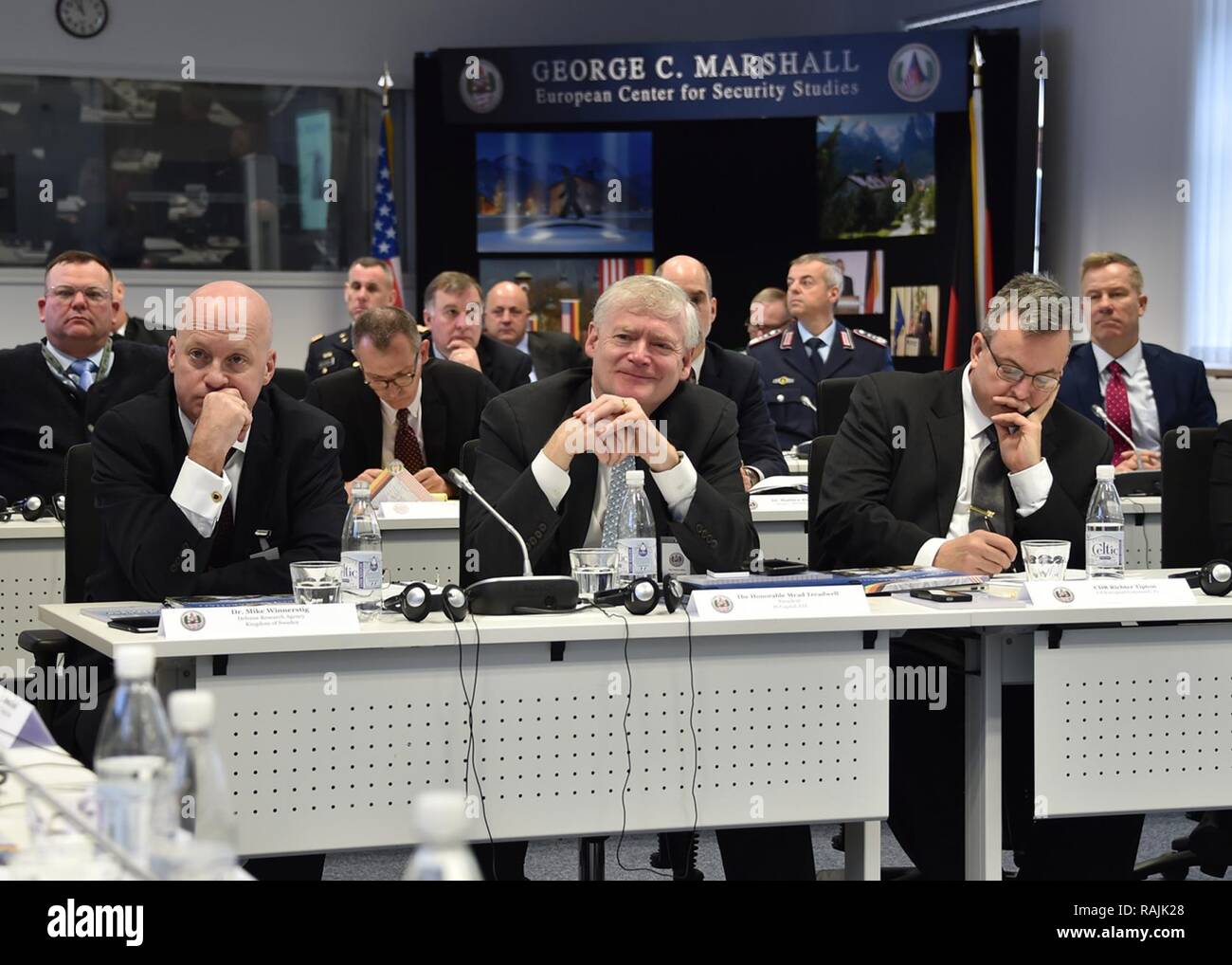 Former Alaska Lt. Gov. Mead Treadwell (center) listens to a