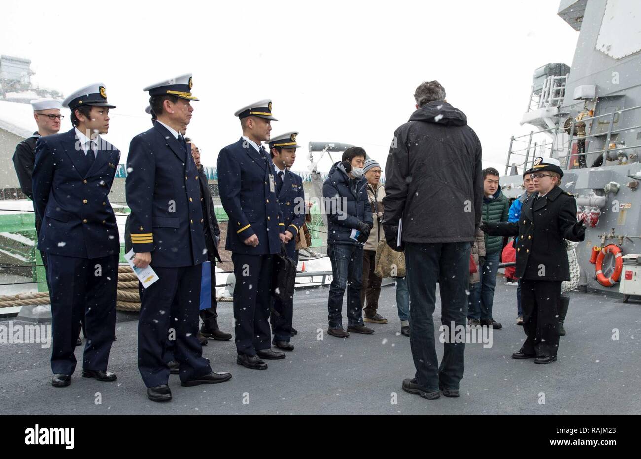 OTARU, Japan (Feb. 04, 2017) Lt. j.g. Shelly Baldwin, assigned to the forward-deployed Arleigh Burke-class guided-missile destroyer USS McCampbell (DDG 85), gives a tour of the ship to members of Japan Coast Guard and city of Otaru Police Department at Otaru, Japan. McCampbell is on patrol in the 7th Fleet area of operations in support of security and stability in the Indo-Asia-Pacific region. Stock Photo