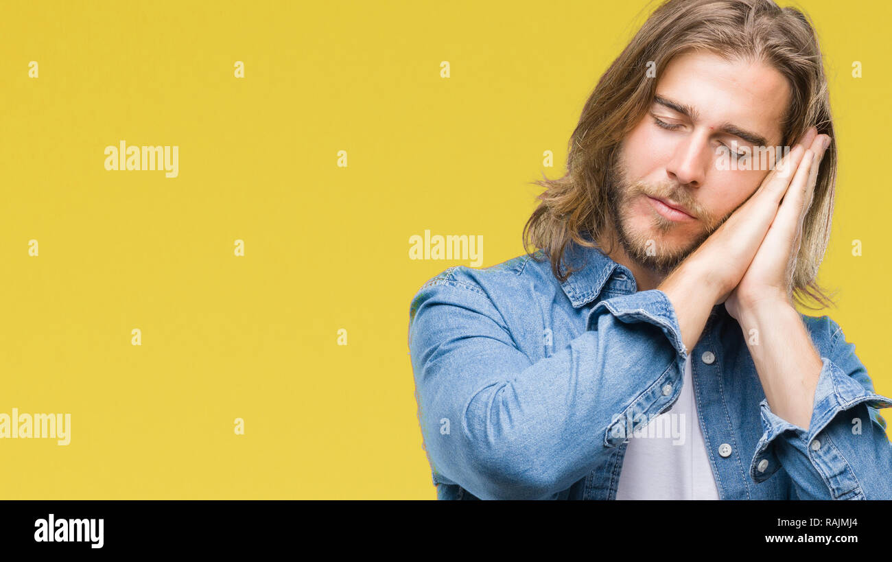 Young Handsome Man With Long Hair Over Isolated Background
