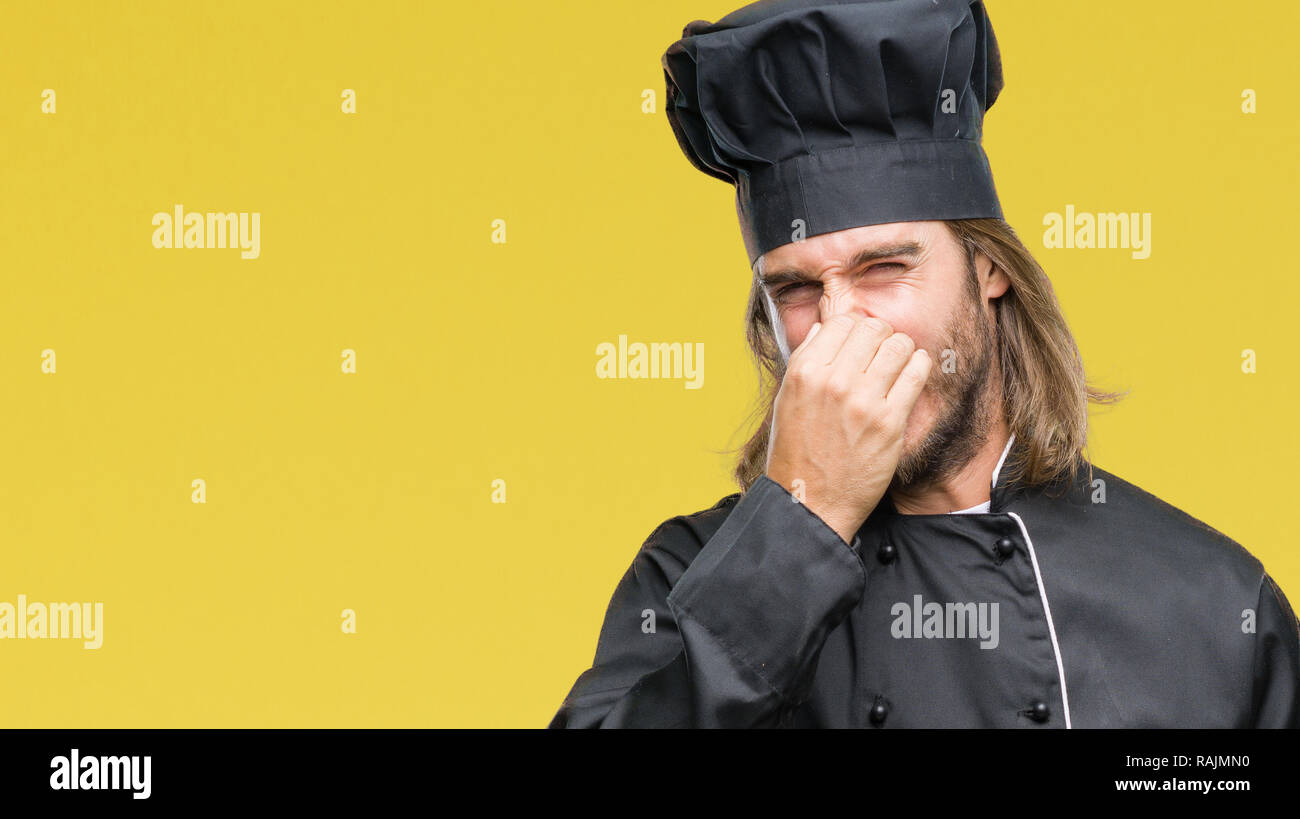 Young handsome cook man with long hair over isolated background ...