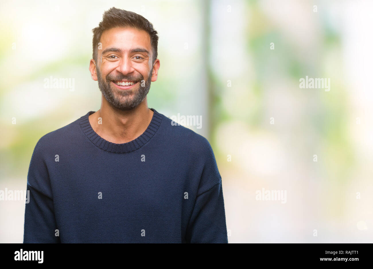 Adult hispanic man over isolated background with a happy and cool smile on face. Lucky person. Stock Photo