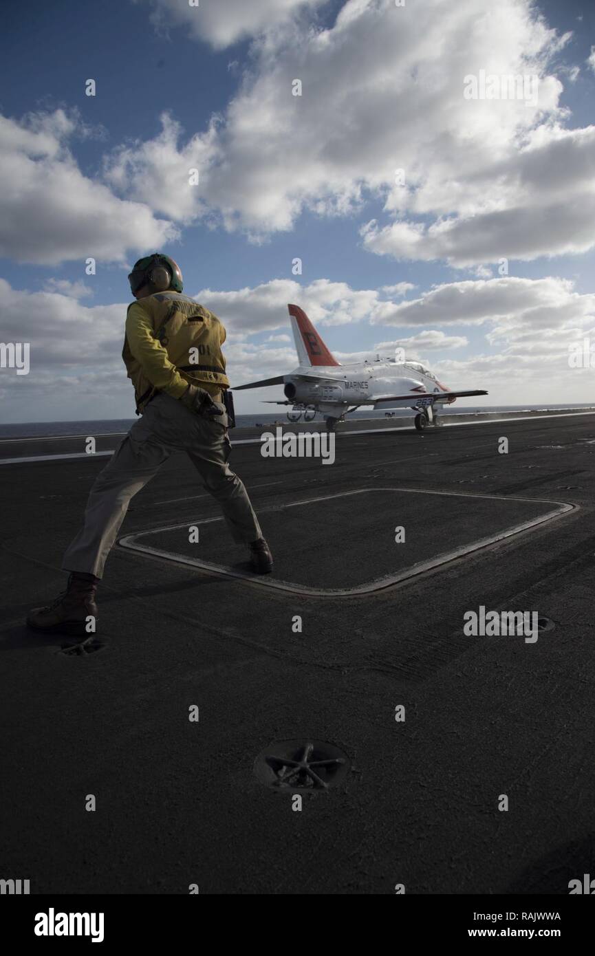 ATLANTIC OCEAN (Feb. 11, 2017) Lt. Sean Anderson, shooter, signals as a T-45C Goshawk assigned to Carrier Training Wing (CTW) 2 launches from the flight deck of the aircraft carrier USS Dwight D. Eisenhower (CVN 69) (Ike). Ike is currently conducting aircraft carrier qualifications during the sustainment phase of the Optimized Fleet Response Plan (OFRP). Stock Photo