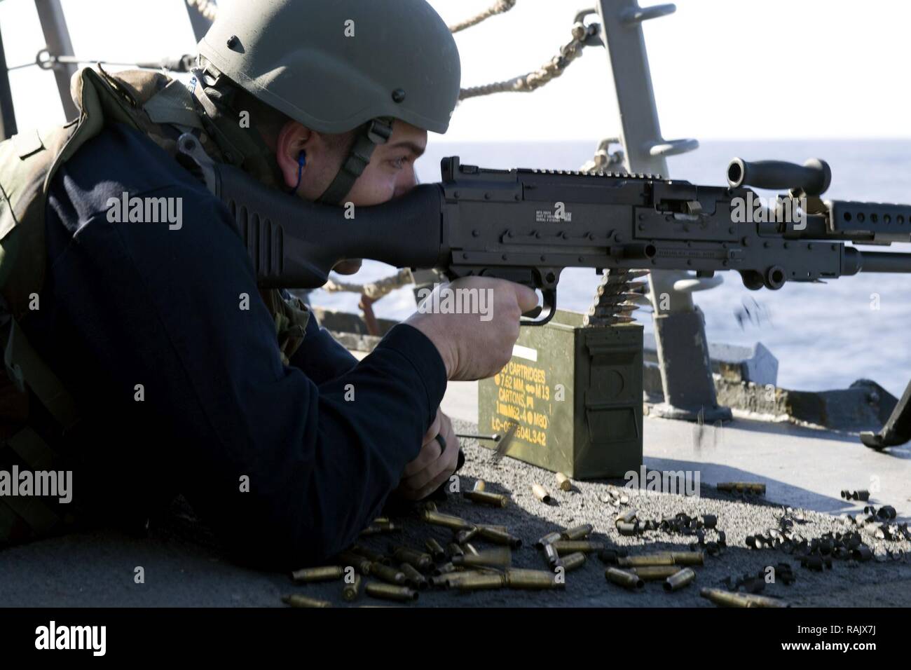 MEDITERRANEAN SEA (Feb. 8, 2017) Logistics Specialist 2nd Class Stephen Lowe fires a .50-caliber machine gun during a live-fire exercise aboard the guided-missile destroyer USS Truxtun (DDG 103). Truxtun, part of the George H.W. Bush Strike Group, is conducting naval operations in the U.S. 6th Fleet area of operations in support of U.S. national security interests in Europe. Stock Photo