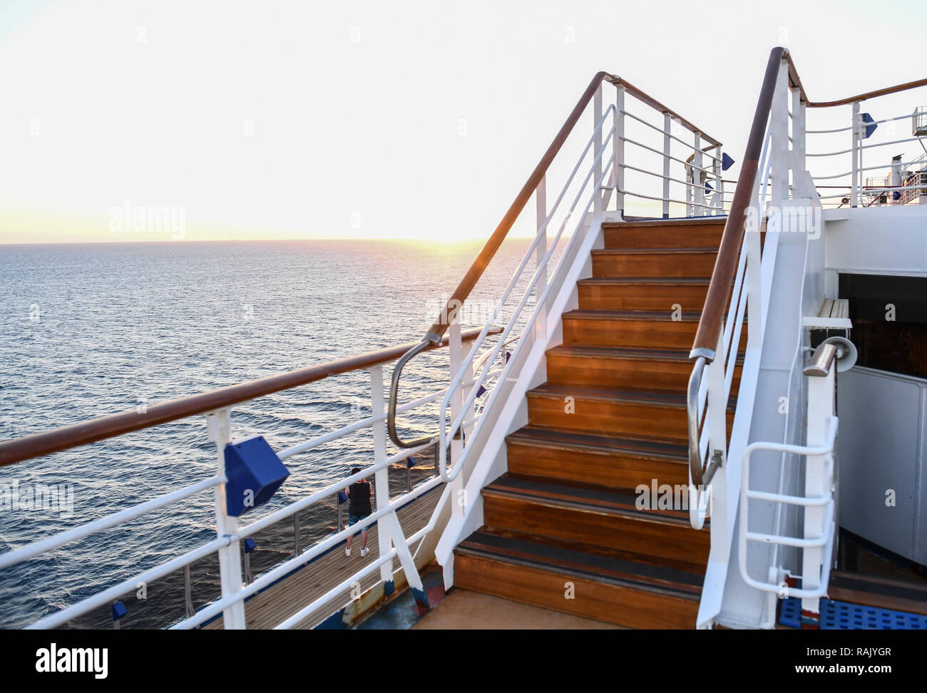 Railing and stairs of a cruise ship at sunset Stock Photo Alamy