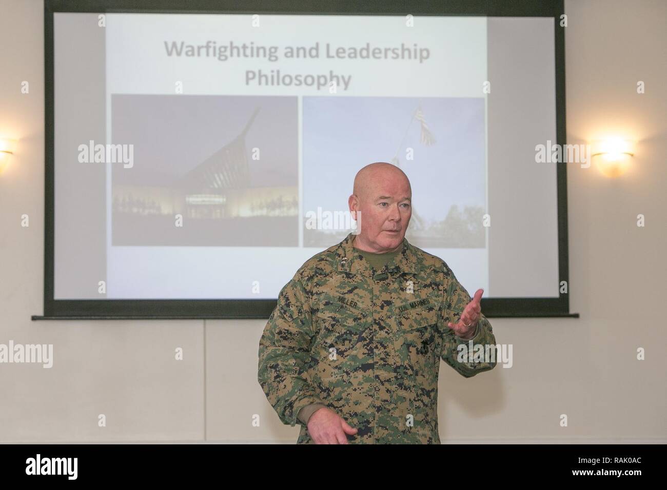U.S. Marine Corps Maj. Gen. Walter L. Miller, Jr., right, commanding general of II Marine Expeditionary Force, delivers the opening remarks, for a presentation on warfighting and leading Marines, to Congressman Mac Thornberry, Chairman of the House Armed Services Committee, and his official party during a visit to Marine Corps Air Station New River, N.C., Feb. 9, 2017. This visit helped develop a fuller understanding of the Marine Corps' leadership philosophy, how it differentiates from other services, and how the philosophy can be applicable to Congressional Staff in their current roles. Stock Photo