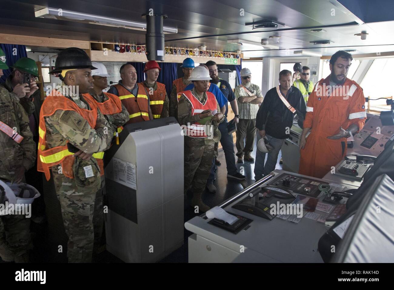 Adler Scott, 3rd Mate of the “Alliance Norfolk” vessel, (right), talks about safety procedures and vessel capabilities during the 2017 Worldwide Ammunition Logistics and Explosives Safety Review in Shuaiba Port, Kuwait, on Feb. 10, 2017. Stock Photo