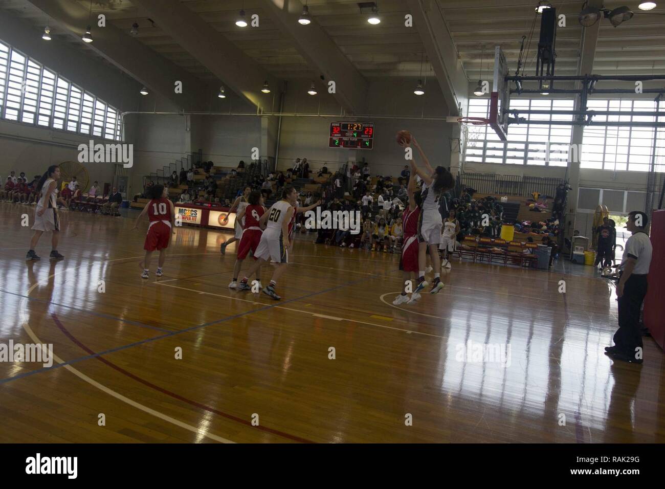 Kadena High School and Maehara High School basketball teams compete during the 11th annual Friendship Basketball Tournament Feb. 4 aboard Camp Foster, Okinawa, Japan. High school teams from the local and military communities on Okinawa attended the tournament, coming together to play friendly games of basketball. “The lessons you learn in hard work, sportsmanship, determination and grit are lessons that are going to pay dividends for the rest of your life,” said Col. William L. DePue, the Camp Foster camp commander, closing his opening remarks to the student athletes. Stock Photo