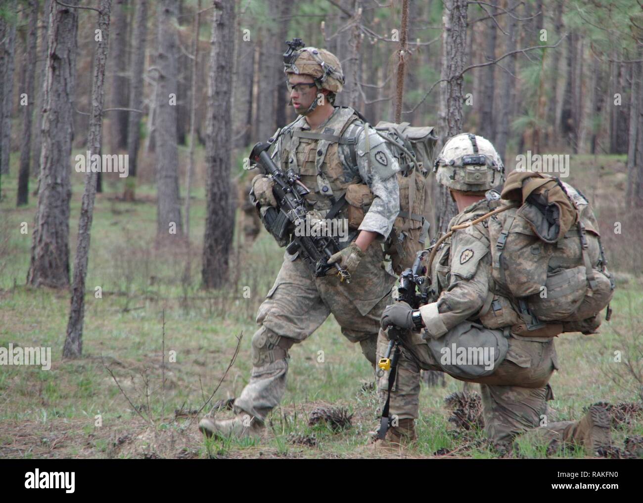 Brigade combat team soldiers demonstrating tactical overwatch positions during readiness training
