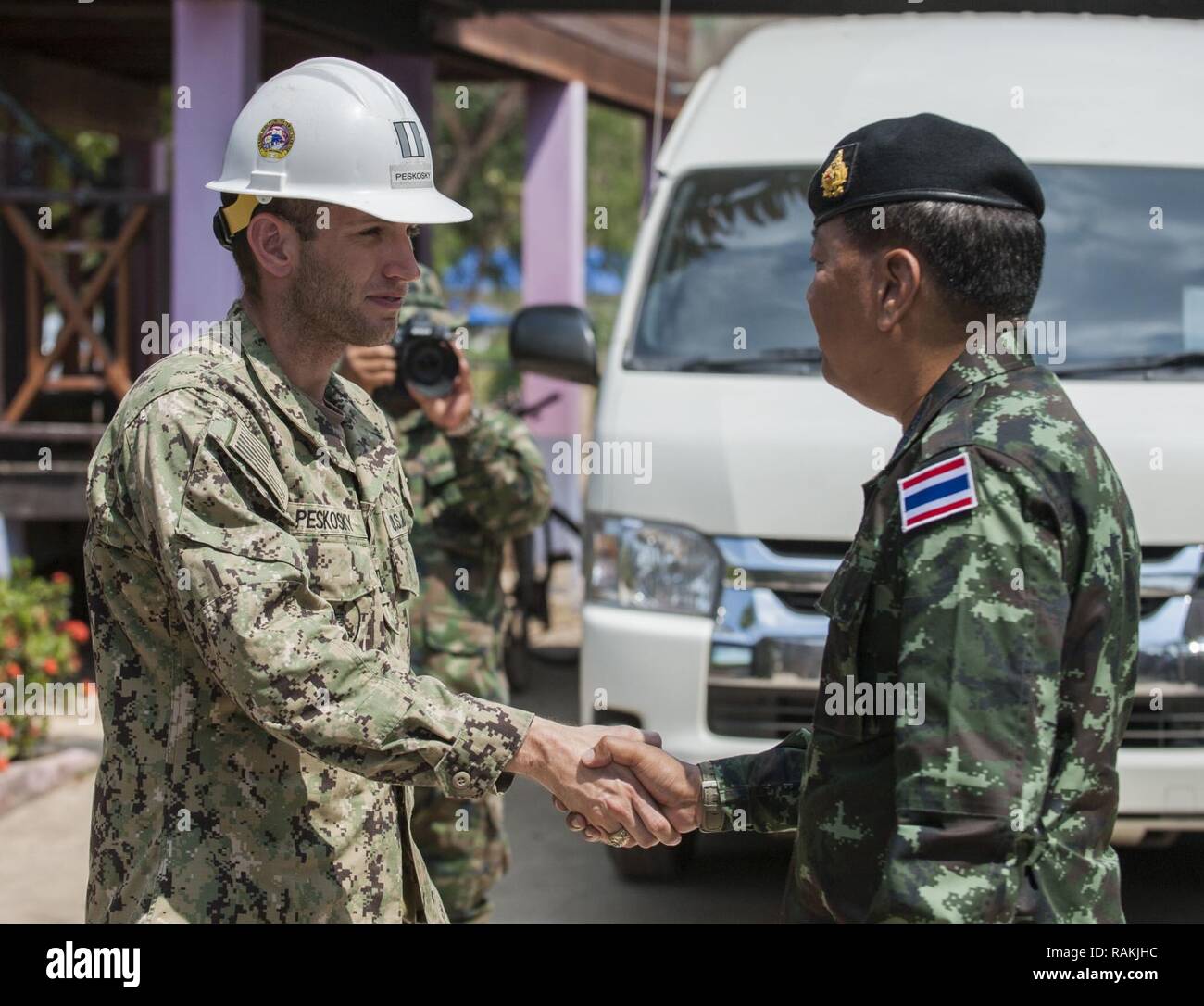 RAYONG PROVINCE, Thailand (Feb. 19, 2017) – Gen. Ponpipat Benyasri, Deputy Chief of Joint Staff, Royal Thai Armed Forces, thanks Lt. Nicholas Peskosky, officer in charge of the Site 6 Ban Nong Muang School project, for the joint effort of the U.S. Naval Mobile Construction Battalion 5, Construction and Developmental Regiment, Sattahip Naval Base and Korean Naval Mobile Construction Battalion 2nd Engineer for the school’s expansion during Cobra Gold 2017.  Cobra Gold, in its 36th iteration, is the largest Theater Security Cooperation exercise in the Indo-Asia-Pacific. This year’s focus is to ad Stock Photo