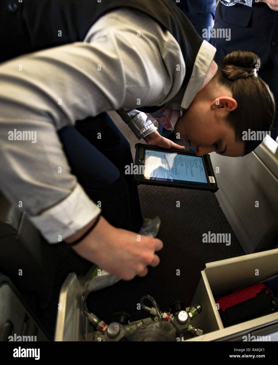 Staff Sgt. Naomi Rice, 1st Airlift Squadron flight attendant, inspects ...