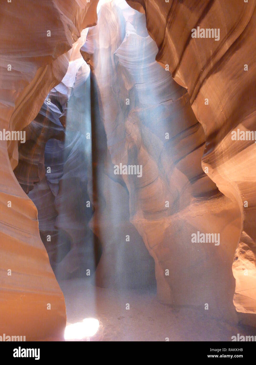 Truly spectacular rays of sun beaming down on the Slot canyon floor, UT in the USA Stock Photo