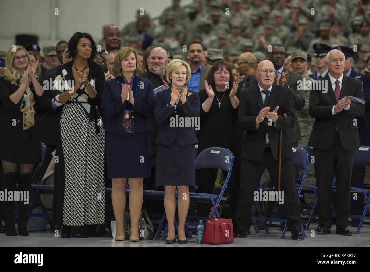 Audience members give an applause during the Chief Master Sergeant of